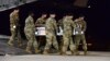 In this image provided by the U.S. Air Force, a U.S. Army carry team transfers the remains of Army Staff Sgt. Dustin Wright of Lyons, Georgia, Oct. 5, 2017, upon arrival at Dover Air Force Base, Delware. Wright, 29, was one of four U.S. troops and four Niger forces killed in an ambush by dozens of Islamic extremists. 