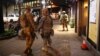 U.S. National Guard soldiers prepare for another night of protests over the police shooting of Keith Scott in Charlotte, North Carolina, Sept. 22, 2016.