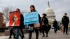 People march in support of the Deferred Action for Childhood Arrivals (DACA), and Temporary Protected Status (TPS), programs, Dec. 5, 2017, on Capitol Hill in Washington. 