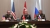 FILE - Turkey's Chief of Staff Gen. Hulusi Akar, center, U.S. Chairman of the Joint Chiefs of Staff Gen. Joseph Dunford, left, and Russia's Chief of Staff Gen. Valery Gerasimov attend a meeting in the Mediterranean coastal city of Antalya, Turkey, March 7, 2017.