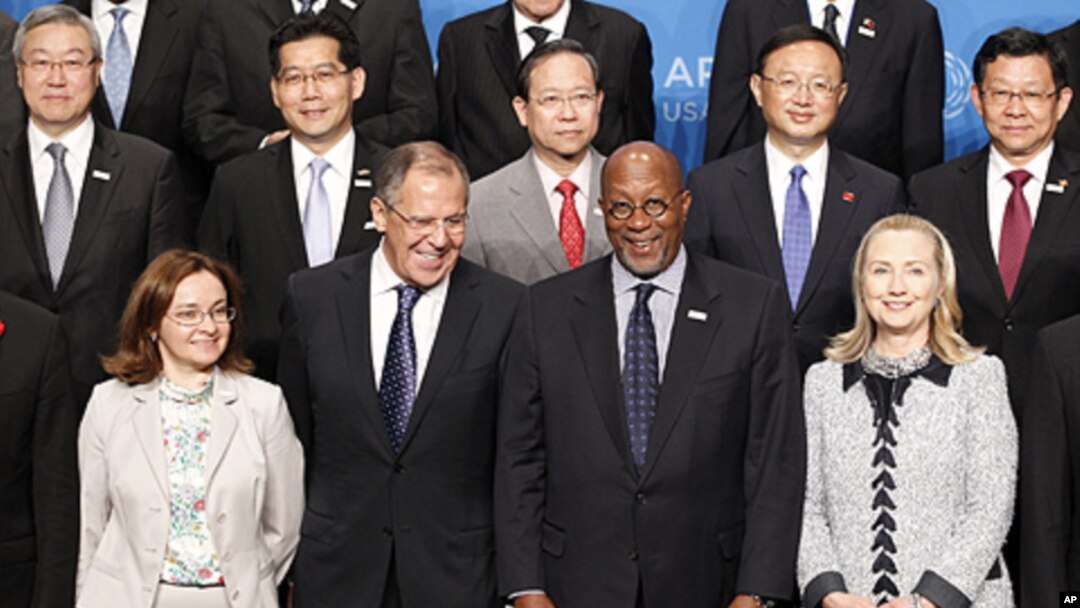(front row) U.S. Secretary of State Hillary Clinton (R) and U.S. Trade Representative Ron Kirk (2nd R) pose with Russia's Foreign Minister Sergei Lavrov (2nd L) and Russian Minister of Economic Development Elvira Nabiullina (L) during the APEC Ministerial