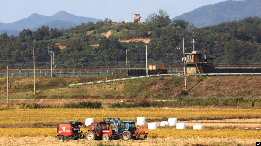 Military guard posts of North Korea, top, and South Korea, center, in Paju, South Korea, near the border with North Korea, Oct. 15, 2019. South Korea is deploying snipers, installing traps and flying drones along the border to kill wild boars.