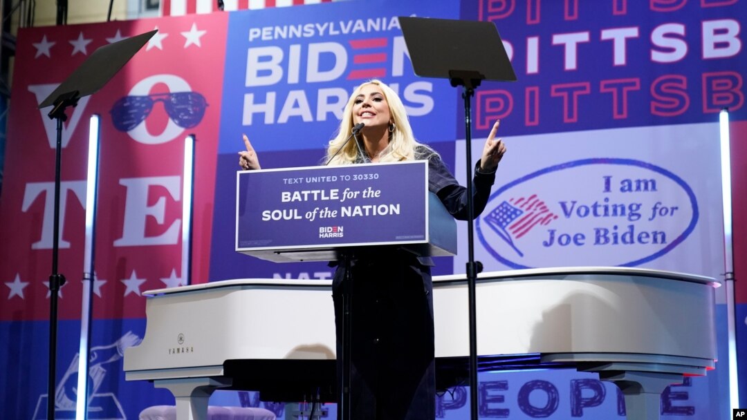 Lady Gaga speaks before performing during a drive-in rally for Democratic presidential candidate former Vice President Joe Biden at Heinz Field, Monday, Nov. 2, 2020, in Pittsburgh. (AP Photo/Andrew Harnik)