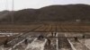 People work in a field outside of Kaesong, North Korea, April 17, 2011. North Korea's perennial food shortage reached a crisis point in 2011, aid workers say, because of torrential rains, the coldest winter in 60 years and rising food prices.