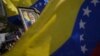 Una pintura del presidente venezolano Nicolás Maduro puede verse en una manifestación a su favor en Caracas, el 25 de marzo de 2024, cuando el jefe de Estado formalizó su candidatura a la votación del próximo 28 de julio.
