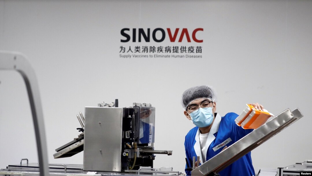 A man works in the packaging facility of Chinese vaccine maker Sinovac Biotech, developing an experimental coronavirus disease (COVID-19) vaccine, in Beijing, China, Sept. 24, 2020.