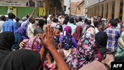 FILE - Sudanese protesters take part in an anti-government demonstration in Khartoum, Feb. 14, 2019. 