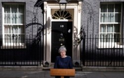 Britain's Prime Minister Theresa May speaks to the media outside her official residence of 10 Downing Street in London, April 18, 2017.