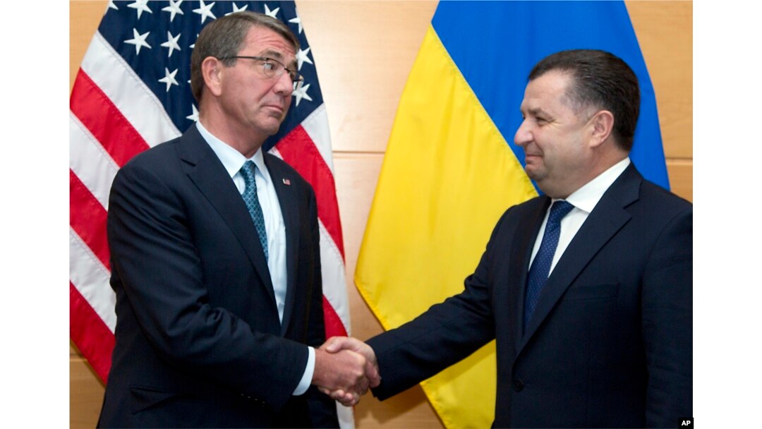 FILE - Ukraine's Defense Minister Stepan Poltorak, right, is greeted by U.S. Secretary of Defense Ash Carter prior to a meeting at NATO headquarters in Brussels, June 15, 2016.
