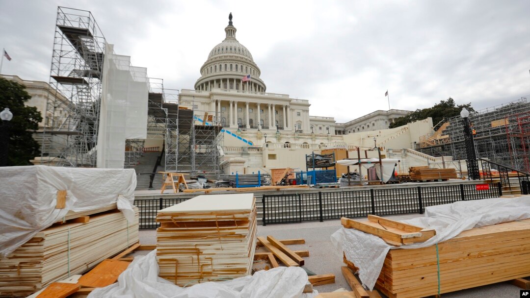 Building materials are stacked as construction continues on the inaugural platform in preparation for the swearing-in ceremonies for President-elect Donald Trump on the Capitol steps in Washington, Dec. 8, 2016. Trump will be sworn in as president on Jan.