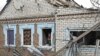 A municipal worker inspects a house damaged by a Russian drone strike, amid Russia's attack on Ukraine, in Zaporizhzhia, Ukraine, Nov. 25, 2024. 