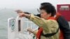 South Korean President Park Geun-hye looks at the site where the Sewol sank from aboard a Coast Guard ship in waters off the southern coast near Jindo, South Korea, Thursday, April 17, 2014.