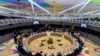 FILE - European Union leaders attend a roundtable meeting at an EU summit in Brussels, March 21, 2019.