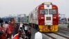 FILE - Kenyan President Uhuru Kenyatta watches a cargo train carrying port containers begin its opening run from Mombasa to Nairobi, Kenya, May 30, 2017. The project was financed by China.