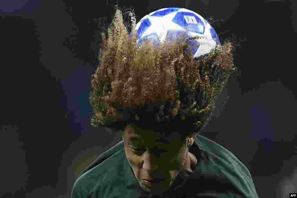 Monaco's French midfielder Han-Noah Massengo heads the ball during the UEFA Champions League group A football match between Atletico Madrid and Monaco at the Wanda Metropolitano stadium in Madrid, Spain, Nov. 28, 2018.