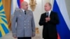 FILE - Russian President Vladimir Putin applauds Col. Gen. Sergei Surovikin during an awards ceremony for troops who fought in Syria, in the Kremlin, in Moscow, Dec. 28, 2017. Putin says Russia's action in Syria has demonstrated the power of the nation's modernized military to the world.