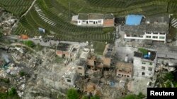 An aerial view shows houses damaged after a strong earthquake in Lushan county, Ya'an, Sichuan province, Apr. 20, 2013. 