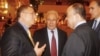 Members of the Syrian opposition chat with Nasser al-Qudwa, deputy to the Arab League and U.N. envoy to Syria, at the meeting of the General Assembly of the Syrian National Council, in Doha, Qatar, November 8, 2012. 