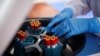 A health worker is seen with blood samples during a testing of municipal workers from the Miraflores district of Lima for the coronavirus disease (COVID-19), in Lima, Peru April 13, 2020.
