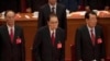 FILE - In this Oct. 24, 2017, photo, former Chinese Premier Li Peng, center, attends the closing session of China's 19th Party Congress at the Great Hall of the People in Beijing, China.