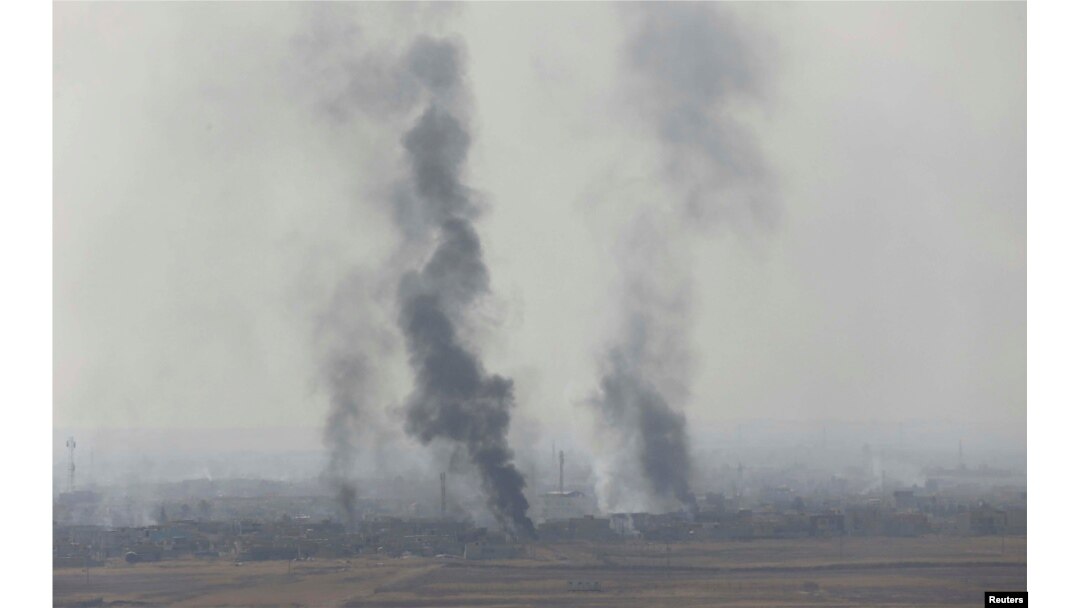 Smoke rises from clashes at Bartila in the east of Mosul during clashes with Islamic State militants, Iraq, Oct. 18, 2016.