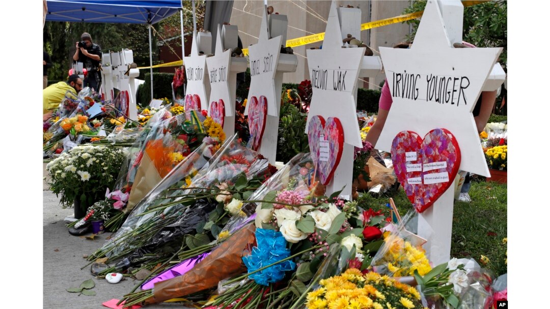 Flowers surround Stars of David, part of a makeshift memorial outside the Tree of Life synagogue in Pittsburgh, Oct. 31, 2018.
