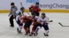 South Korea, wearing white uniforms, and North Korean players compete during their IIHF Ice Hockey Women's World Championship Division II Group A game in Gangneung, South Korea, April 6, 2017. 