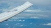 Američki izviđački avion P-8A Posejdon leti u blizini kineskih objekata i zgrada na veštačkom grebenu Vatreni krst u grupi ostrva Spratlis u Južnom kineskom moru, 20. marta 2022.