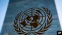 FILE - The symbol of the United Nations is displayed outside the Secretariat Building, Feb. 28, 2022, at United Nations headquarters.