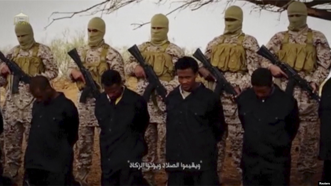 Militants from the so-called Islamic State stand behind what are said to be Ethiopian Christians in Libya, in this still image from an undated video posted to a social media website on April 19, 2015.