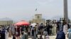 Hundreds of people are seen gathered outside the international airport in Kabul, Afghanistan, Aug. 17, 2021, in hopes of catching a flight out of the country.
