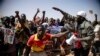 FILE - People take to the streets of Ouagadougou, Burkina Faso, Jan. 25, 2022. to rally in support of the new military junta that ousted democratically elected President Roch Marc Christian Kabore and seized control of the country.