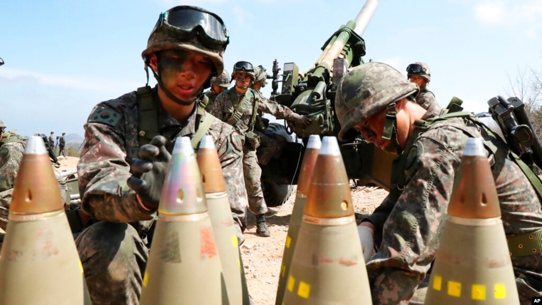 FILE - South Korean army soldiers arrange 155 mm howitzer shells during a military exercise in Goseong, South Korea, on April 4, 2016.