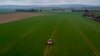 FILE - A farmer fertilizes a field on the outskirts of Frankfurt, Germany, April 4, 2022. Russia's war in Ukraine pushed up fertilizer prices but they have come down since their peak in mid-2022.