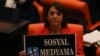 A lawmaker from the main opposition Republican People's Party holds up a placard that reads "Don't touch my social media" in protest at the parliament, in Ankara, Turkey, Oct. 11, 2022.