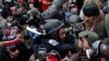 FILE - Pro-Trump protesters clash with DC police officer Michael Fanone at a rally to contest the certification of the 2020 US presidential election results at the U.S. Capitol Building, Jan. 6, 2021.