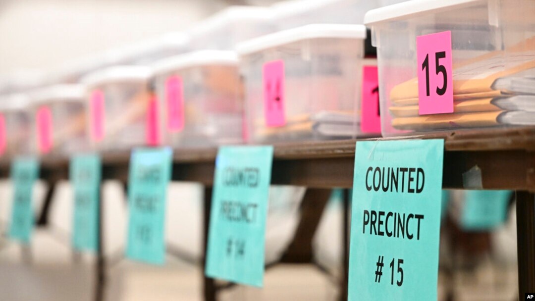 Counted ballots for various precincts are displayed at the Flathead County Fairgrounds in Kalispell, Mont., on Nov. 9, 2022. 