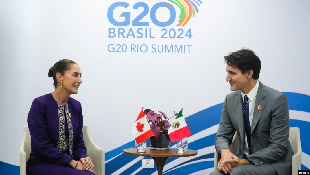 FILE - Mexico's President Claudia Sheinbaum, left, meets with the Canada's Prime Minister Justin Trudeau on the sidelines of the G20 Summit, in Rio de Janeiro, Nov. 18, 2024. (Mexico Presidency/Handout via Reuters)