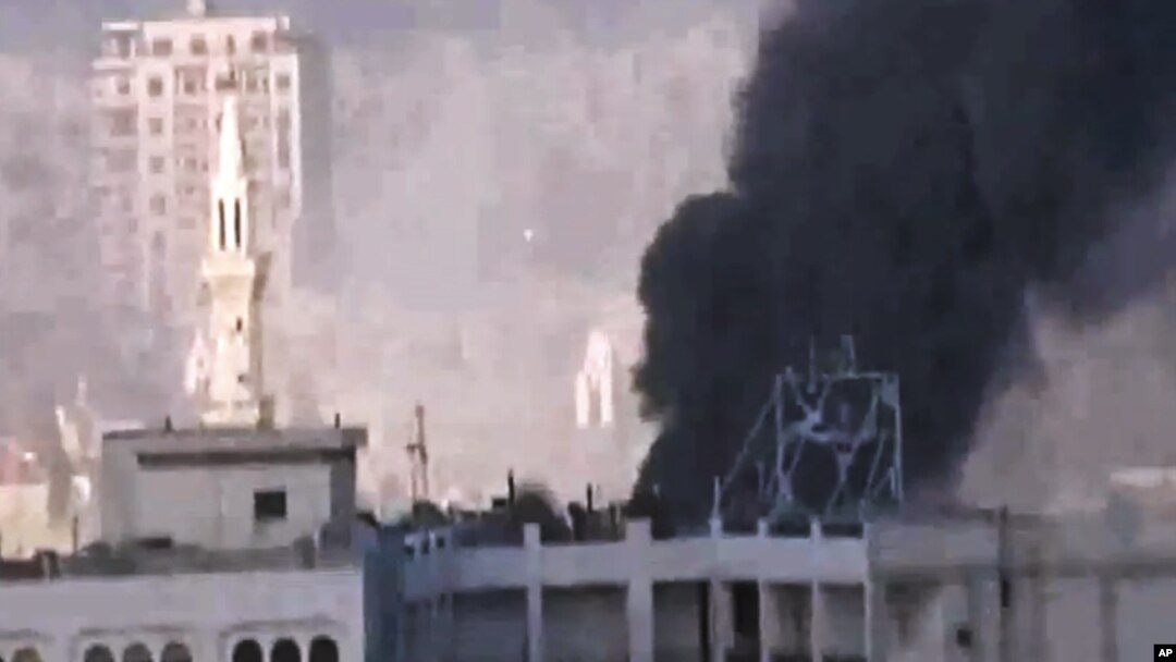 In this image made from amateur video released by the Shaam News Network and accessed May 30, 2012, purports to show black smoke leaping the air from shelling in Homs, Syria. 