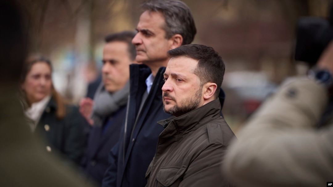 Ukrainian President Volodymyr Zelenskyy, center right, and Greek Prime Minister Kyriakos Mitsotakis visit the site of a Russian attack at a residential area in Odesa, Ukraine, on March 6, 2024.