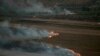 Flames and smoke rise from where Israeli army shells that landed in the southern Lebanese border village of Maroun Al-Ras, Lebanon, Sept. 1, 2019. 