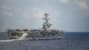 一架F/A-18F超级大黄蜂战机从美国海军“西奥多·罗斯福号”航空母舰的甲板起飞。(2020年3月18日)