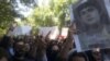 Tehran University students gathered on May 13, 2019, to protest heightened enforcement of mandatory veiling for women during Ramadan and to highlight other concerns such as the May 1, 2019, arrest of journalist Marzieh Amiri, seen pictured on the right.