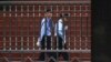 FILE - Chinese policemen are seen on patrol in southwest China's Sichuan province, Sept. 24, 2012. A police report on the death of a 14-year-old student whose body was found outside his dormitory at Taifu Middle School in Luzhou, Sichuan province, has raised questions about the investigation.