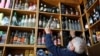 Mustafa Demirci arranges bottles of alcoholic beverages at his liquor shop ahead of a nationwide "full closure" amid the spread of the coronavirus, in Ankara, Turkey, April 28, 2021. 
