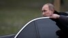 FILE - Russian President Vladimir Putin is seen getting out of his limousine in Moscow, Russia, Feb. 23, 2014.