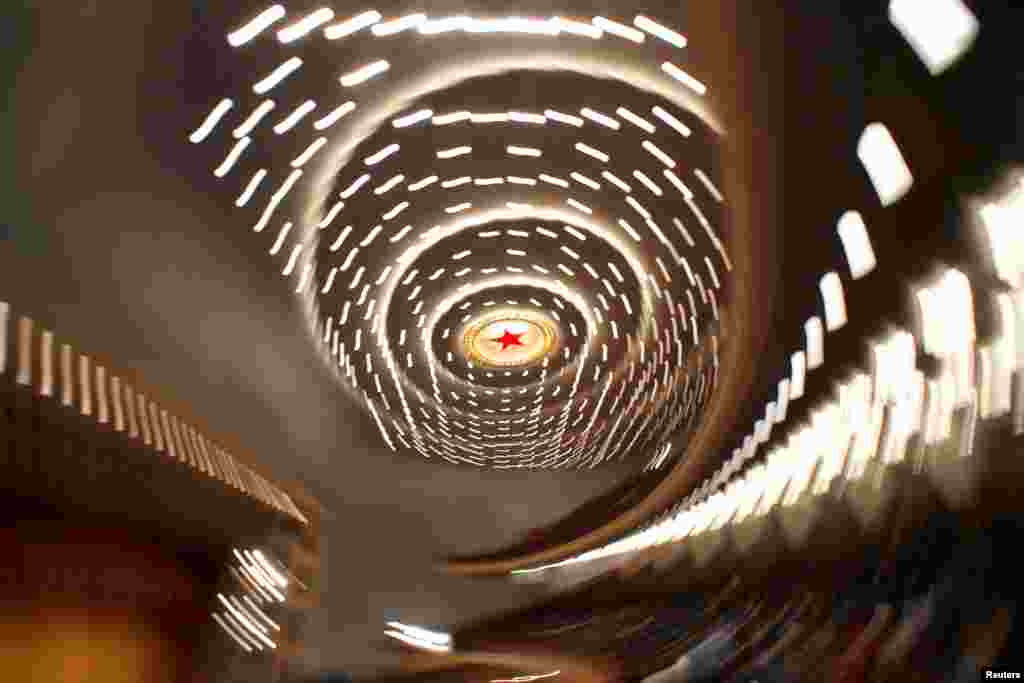 A red light in the shape of a five-pointed star is seen among the lights on the ceiling of the Great Hall of the People during the second plenary session of the National People's Congress (NPC) in Beijing, China.