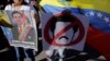 Venezuelans living in Honduras hold a protest against Venezuelan President Nicolas Maduro's government in Tegucigalpa, Honduras, Jan. 23, 2019.