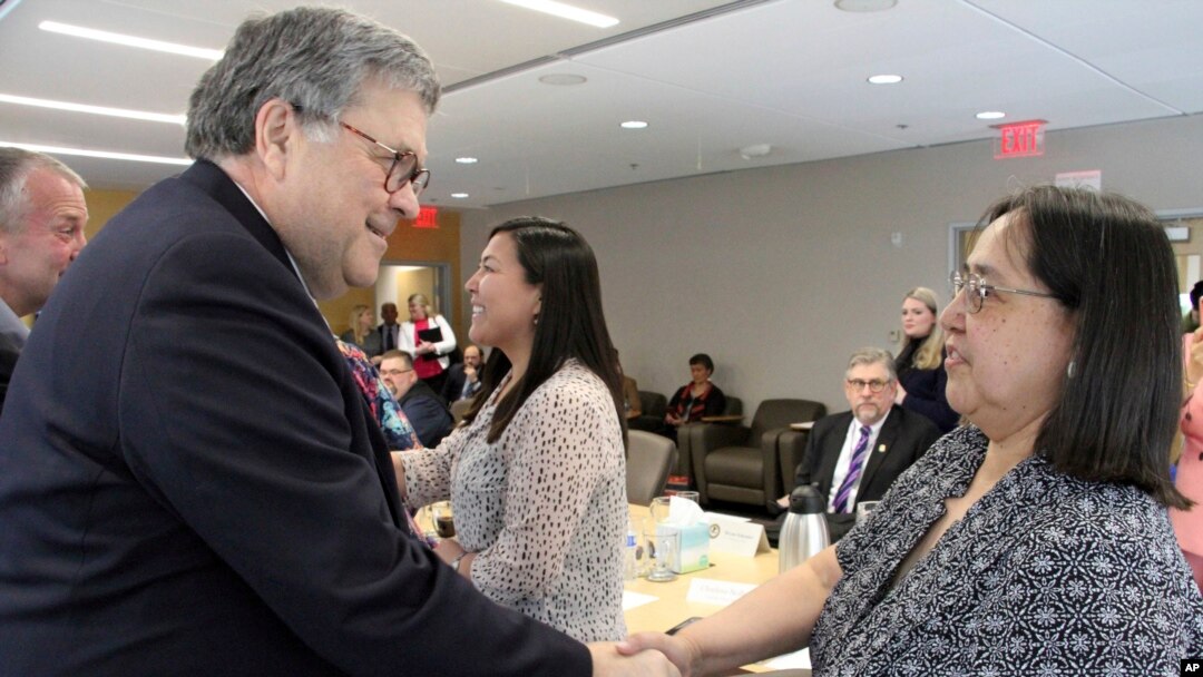 U.S. Attorney General William Barr, left, greets Vivian Korthius with the Association of Village Council Presidents at a discussion at the Alaska Native Tribal Health Consortium, May 29, 2019, in Anchorage, Alaska, where participants discussed public safety concerns in Alaska.