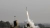 FILE - An Israeli missile launched from the Iron Dome defense missile system, designed to intercept and destroy incoming short-range rockets and artillery shells, is pictured in the southern Israeli city of Sderot, Nov. 12, 2019.